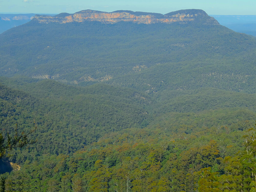 V-shaped valleys below Mt Solitary’s cliffs About the Mountains