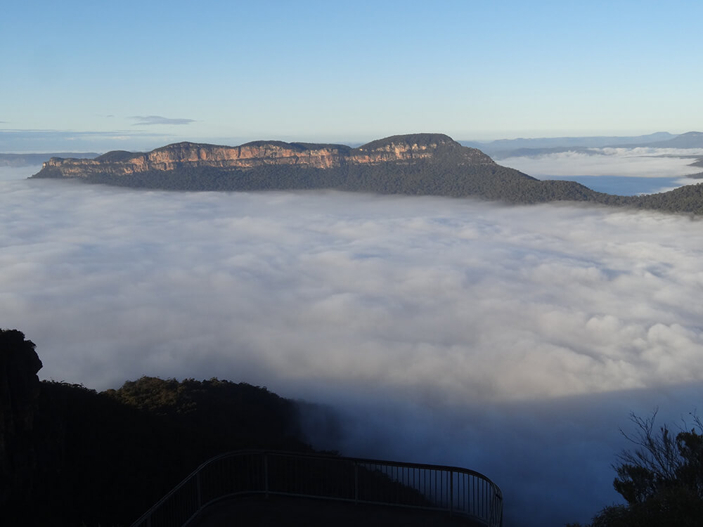 Mt Solitary amidst a sea of cloud About the Mountains