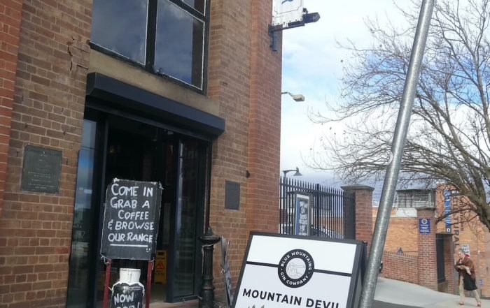 Mountain Devil Gin poster outside the Carrington Hotel